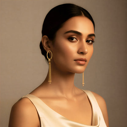 Gold oval drop earrings with chain tassels