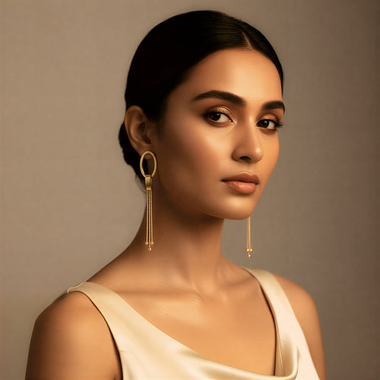 Gold oval drop earrings with chain tassels